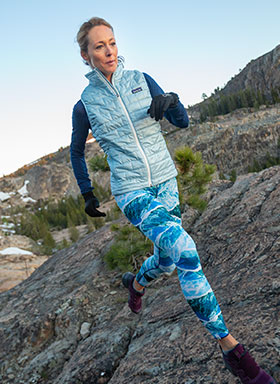 woman running wearing a vest